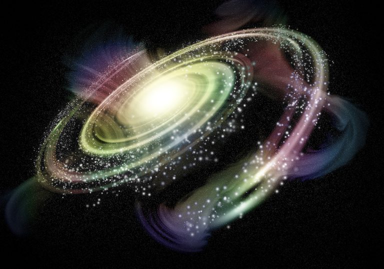 A spiral galaxy glowing in pink, green and gold against black space
